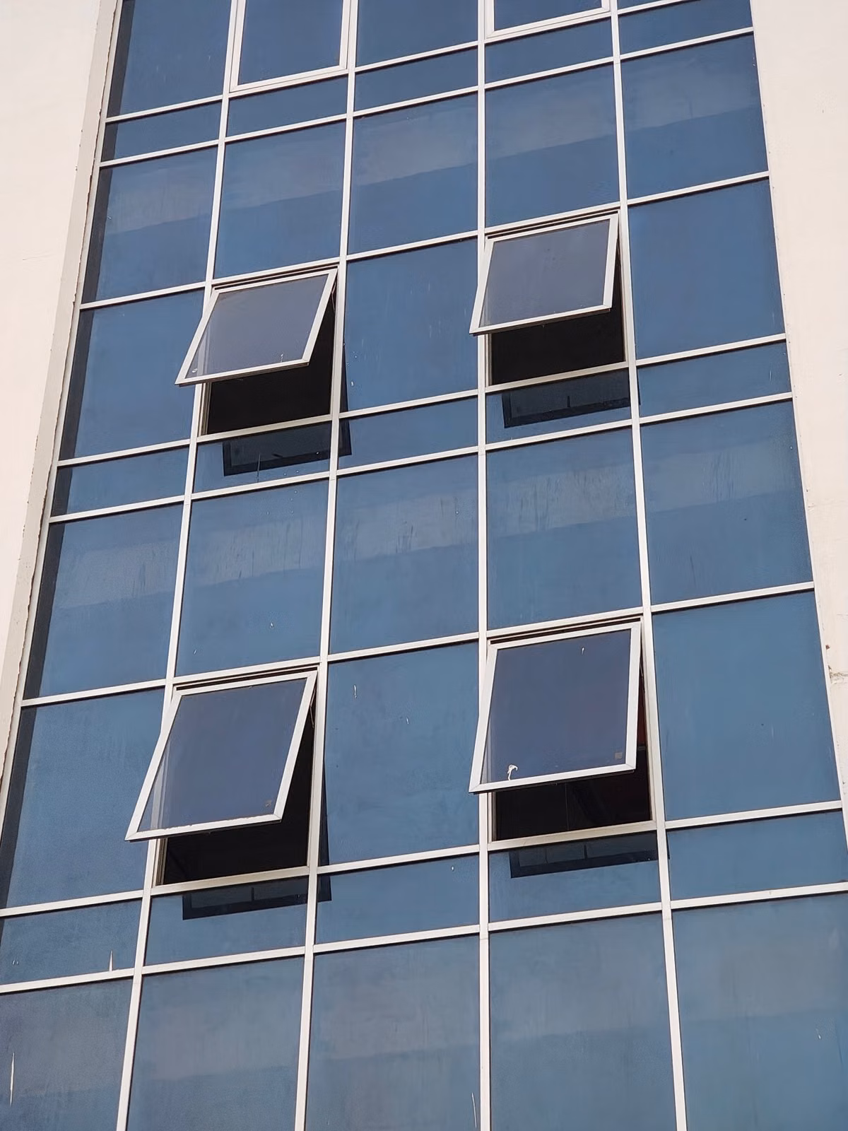 Stock photo of a modern glass building facade, for illustration only.